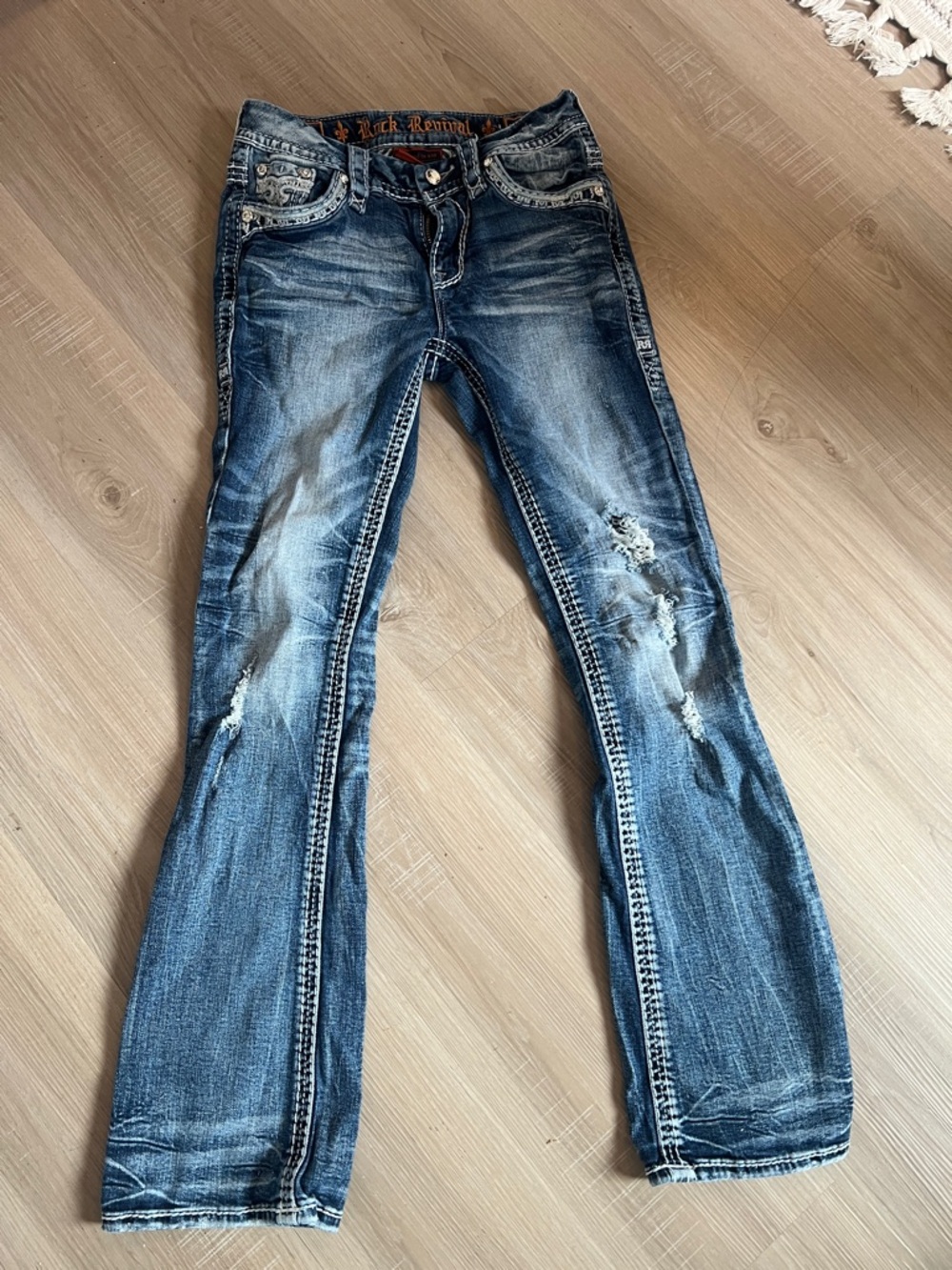 Rock Revival Women's Faded Blue Bootcut Jeans with Distressed Details